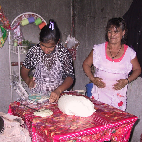 Give a gift that matters: a donation in your friend's name. A $250 loan could allow a client to buy a commercial tortilla press to launch a business selling tor